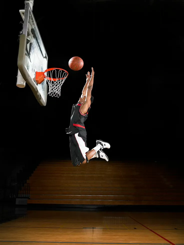Basketball player rising to the rim